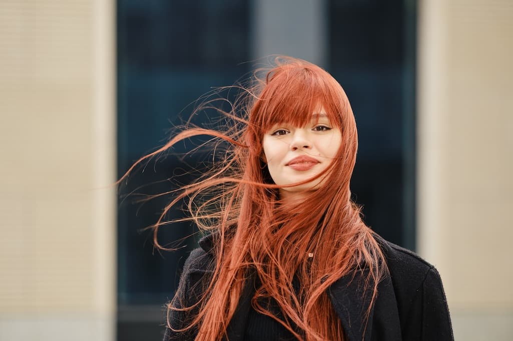 street-portrait-of-a-happy-young-red-haired-woman-2025-01-08-05-25-22-utc.jpg